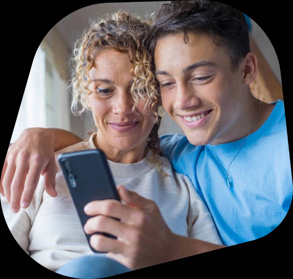 Parent and child looking at phone together